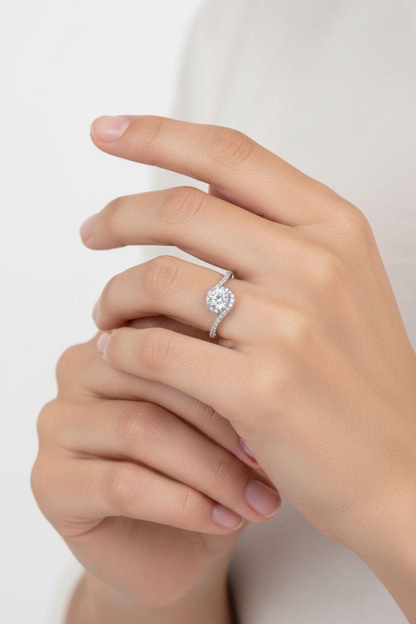 Delicate engagement ring on hand