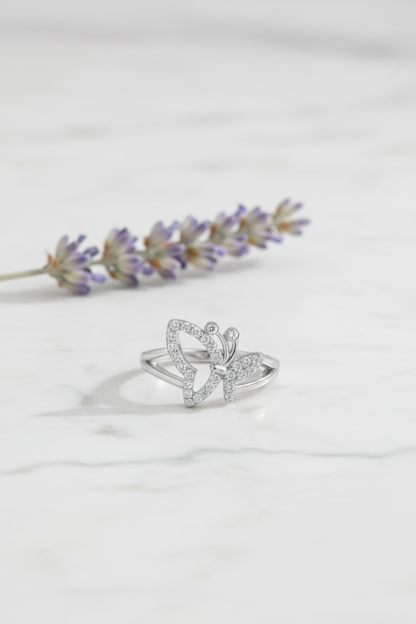 Butterfly ring on white marble with lavender