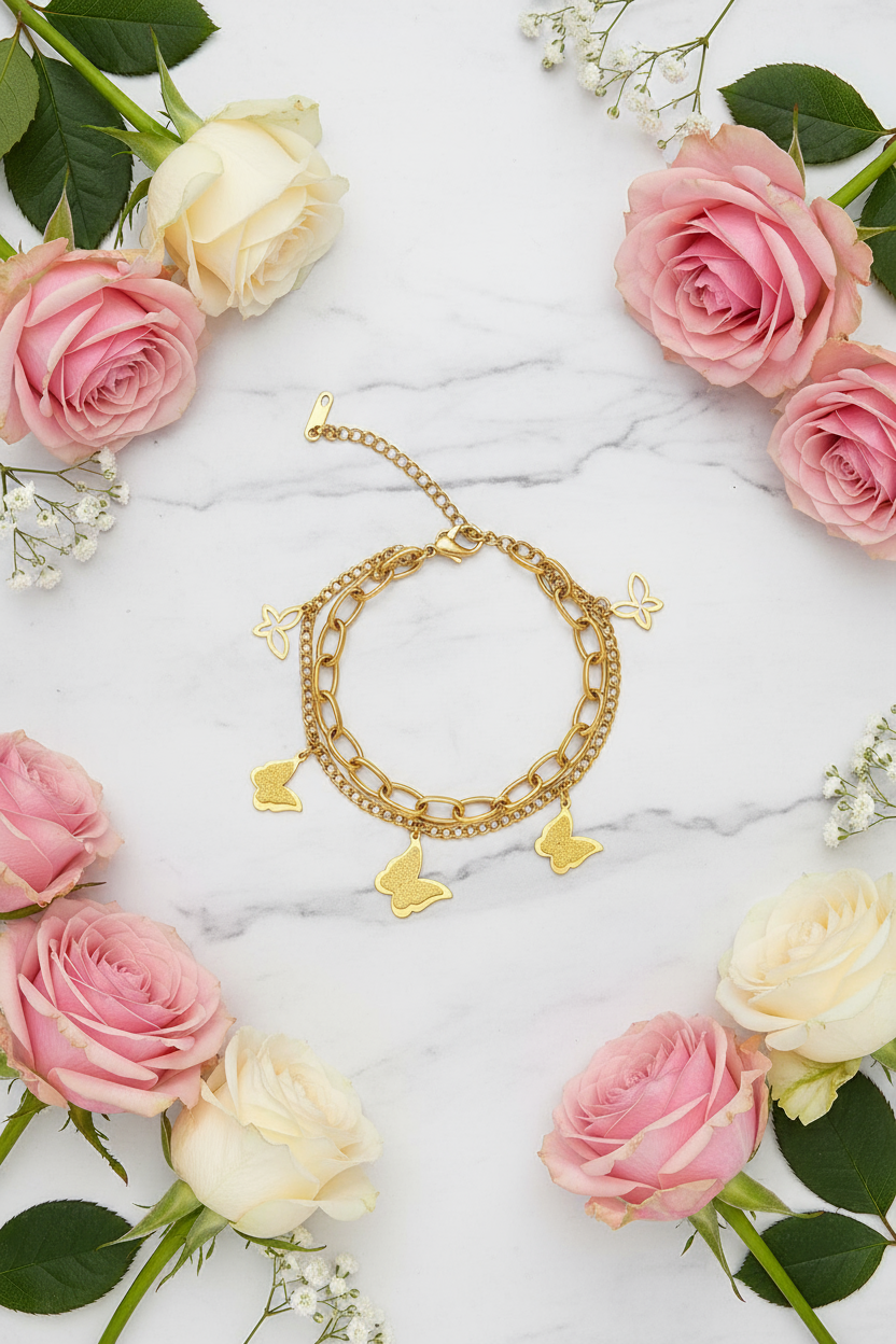 Flat lay with bracelet, roses, and marble background