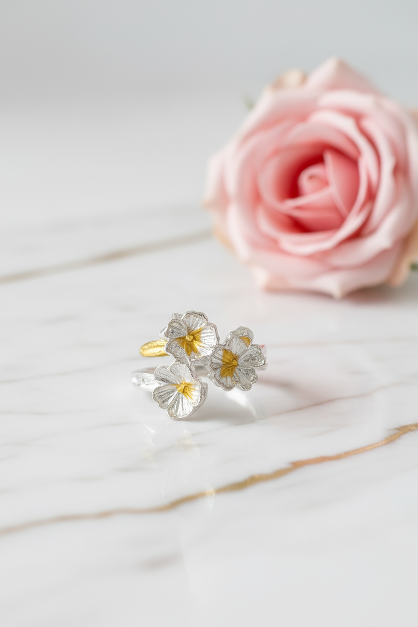Floral ring on marble with pink rose